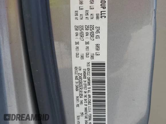 2014 Dodge Grand Caravan American Value with VIN 2C4RDGBG5ER101854, listed as a Copart auction lot 67929095 with 165,607 mi miles and Salvage title. Bid and sale history available at DreamBid. Image 13.