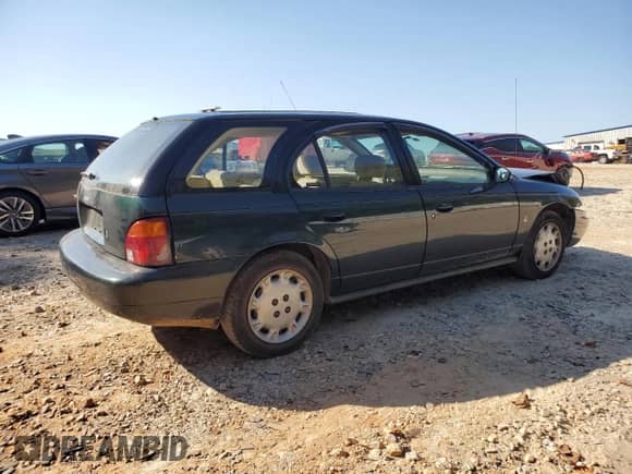 1997 Saturn SW with VIN 1G8ZK8278VZ379899, listed as a Copart auction lot 74913664 with 126,186 mi miles and Salvage title. Bid and sale history available at DreamBid. Image 3.