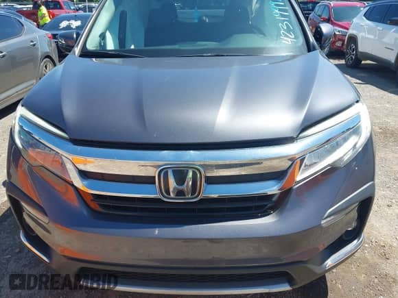 2020 Honda Pilot Touring 7-Passenger z VIN 5FNYF5H69LB015626, wystawiony jako IAAI lot #42319992 z przebiegiem 134 084 mil mil oraz . Historia ofert i sprzedaży dostępna na DreamBid. Obrazek 12.