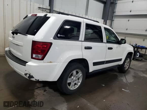 2006 Jeep Grand Cherokee Laredo with VIN 1J4GR48K76C255988, listed as a Copart auction lot 68521495 with 171,036 mi miles and Salvage title. Bid and sale history available at DreamBid. Image 3.