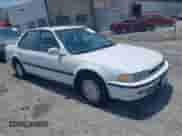 1993 Honda Accord LX z VIN JHMCB7653PC002464, wystawiony jako IAAI lot #42582131 z przebiegiem 243 918 mil mil oraz . Historia ofert i sprzedaży dostępna na DreamBid. Obrazek 1.