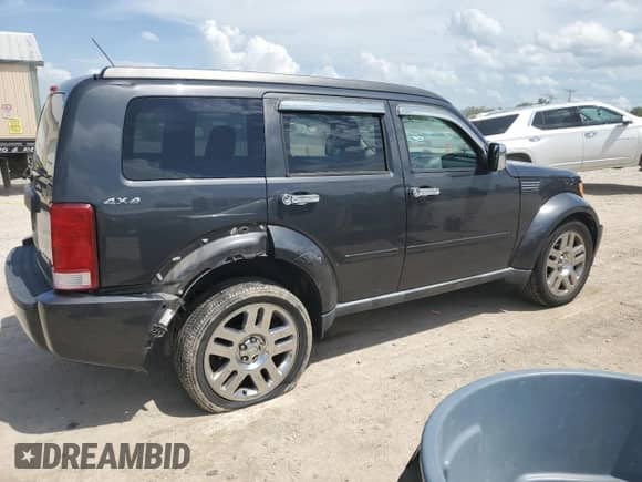 2010 Dodge Nitro Heat with VIN 1D4PU4GK2AW174333, listed as a Copart auction lot 62385005 with 99,307 mi miles and Salvage title. Bid and sale history available at DreamBid. Image 3.