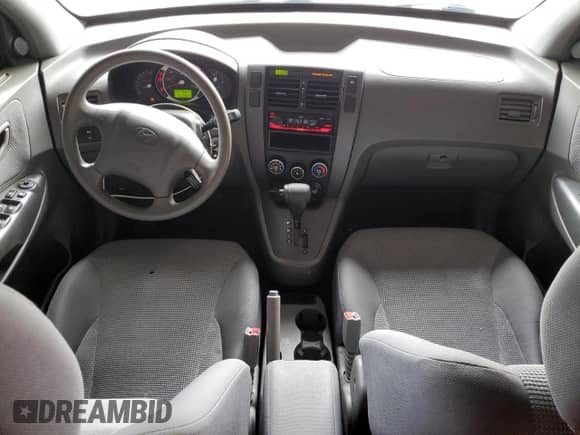 2006 Hyundai Tucson GL z VIN KM8JM12B86U435570, wystawiony jako Copart lot #82398565 z przebiegiem 81 243 mil mil oraz Szkoda całkowita • Salvage title. Historia ofert i sprzedaży dostępna na DreamBid. Obrazek 8.