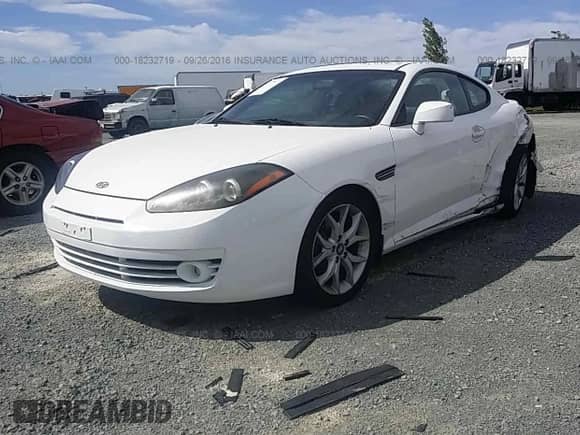 2007 Hyundai Tiburon GT с VIN KMHHN66F57U253381, выставлен на аукционе IAAI как лот 18232719 с пробегом 124 101 миль миль и . История ставок и продаж доступна на DreamBid. Изображение 2.