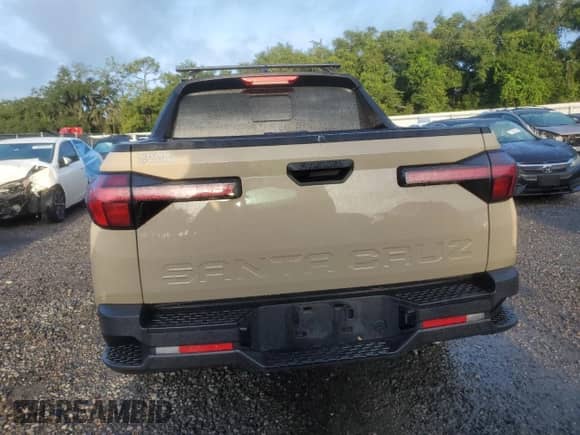 2023 Hyundai Santa Cruz SEL с VIN 5NTJC4AEXPH053557, выставлен на аукционе Copart как лот 70206074 с пробегом Не указан миль и На запчасти • Non repairable. История ставок и продаж доступна на DreamBid. Изображение 6.