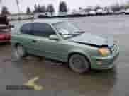 2004 Hyundai Accent GL z VIN KMHCG35C84U303390, wystawiony jako Copart lot #47976065 z przebiegiem 128 648 mil mil oraz Szkoda całkowita • Salvage title. Historia ofert i sprzedaży dostępna na DreamBid. Obrazek 4.