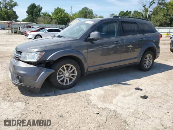 2015 Dodge Journey SXT with VIN 3C4PDCBGXFT673565, listed as a Copart auction lot 68763745 with 160,081 mi miles and Salvage title. Bid and sale history available at DreamBid. Image 1.