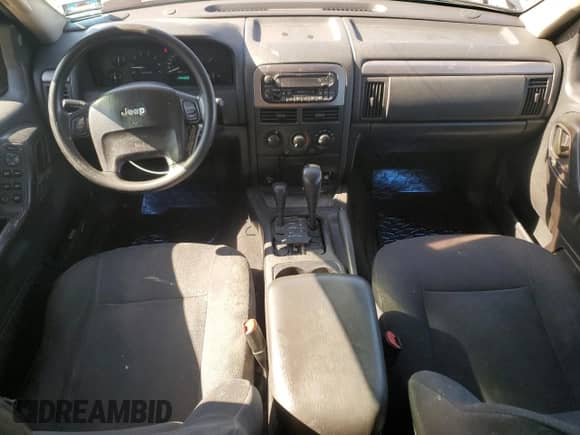 2002 Jeep Grand Cherokee Laredo with VIN 1J4GW48S42C251464, listed as a Copart auction lot 71964815 with 144,429 mi miles and Salvage title. Bid and sale history available at DreamBid. Image 8.