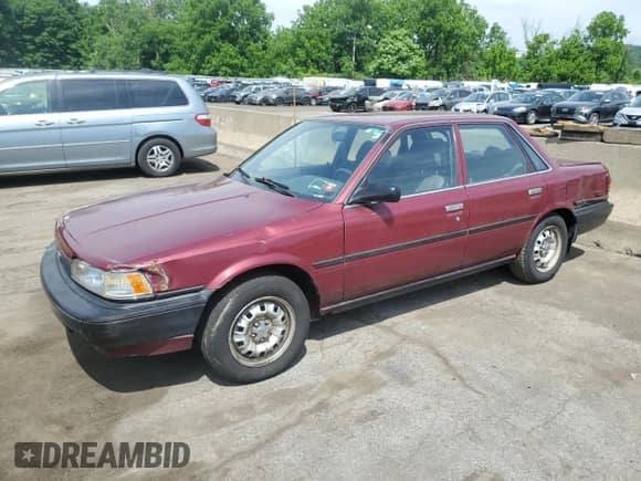 1991 Toyota Camry z VIN 4T1SV24E2MU387012, wystawiony jako Copart lot #57576164 z przebiegiem 117 436 mil mil oraz Nie do naprawy • Non repairable. Historia ofert i sprzedaży dostępna na DreamBid. Obrazek 1.