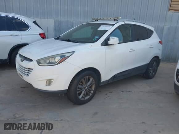2015 Hyundai Tucson SE with VIN KM8JU3AG4FU115462, listed as a IAAI auction lot 43153108 with 97,807 mi miles and . Bid and sale history available at DreamBid. Image 2.