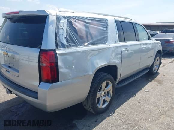 2018 Chevrolet Suburban LT z VIN 1GNSCHKC7JR317414, wystawiony jako IAAI lot #42874214 z przebiegiem 98 281 mil mil oraz . Historia ofert i sprzedaży dostępna na DreamBid. Obrazek 4.