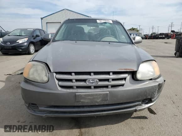 2004 Hyundai Accent GL z VIN KMHCG35C34U290855, wystawiony jako Copart lot #70719664 z przebiegiem 176 210 mil mil oraz Szkoda całkowita • Salvage title. Historia ofert i sprzedaży dostępna na DreamBid. Obrazek 5.