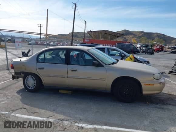 2005 Chevrolet Malibu Classic z VIN 1G1ND52F45M103228, wystawiony jako IAAI lot #41598924 z przebiegiem 141 693 mil mil oraz . Historia ofert i sprzedaży dostępna na DreamBid. Obrazek 14.