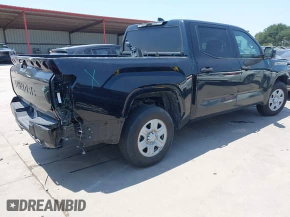 2022 Toyota Tundra SR with VIN 5TFKB5AB7NX017988, listed as a IAAI auction lot 42986871 with 50,437 mi miles and . Bid and sale history available at DreamBid. Image 4.