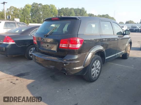 2015 Dodge Journey American Value with VIN 3C4PDCAB0FT736386, listed as a IAAI auction lot 43035576 with 236,569 mi miles and . Bid and sale history available at DreamBid. Image 4.