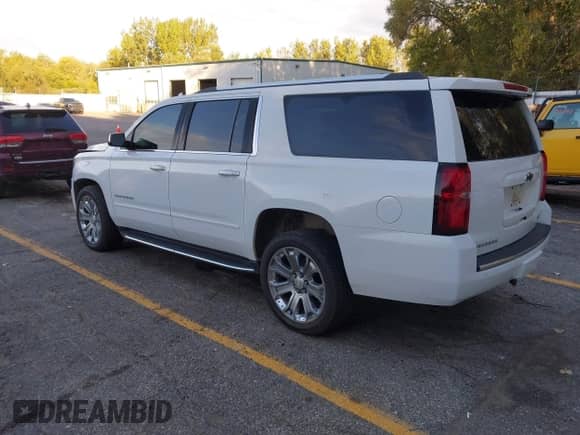 2018 Chevrolet Suburban Premier z VIN 1GNSKJKC5JR264383, wystawiony jako IAAI lot #43418058 z przebiegiem 105 696 mil mil oraz . Historia ofert i sprzedaży dostępna na DreamBid. Obrazek 3.