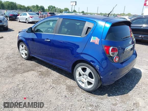 2014 Chevrolet Sonic LTZ with VIN 1G1JE6SBXE4202876, listed as a IAAI auction lot 42470700 with 155,689 mi miles and . Bid and sale history available at DreamBid. Image 3.