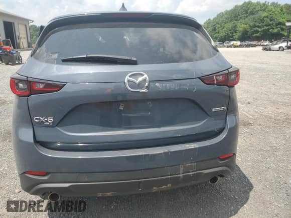 2022 Mazda CX-5 S Carbon Edition z VIN JM3KFBCMXN1560411, wystawiony jako Copart lot #65896595 z przebiegiem Nie podano mil oraz Szkoda całkowita • Salvage title. Historia ofert i sprzedaży dostępna na DreamBid. Obrazek 6.
