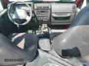 2000 Jeep Wrangler Sport z VIN 1J4FA49S6YP795653, wystawiony jako Copart lot #67831125 z przebiegiem 213 754 mil mil oraz Czysty tytuł • Clean title. Historia ofert i sprzedaży dostępna na DreamBid. Obrazek 8.