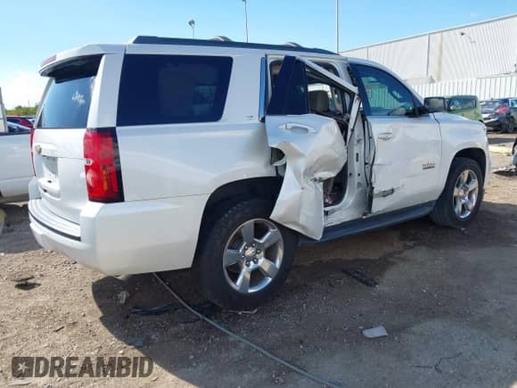 2017 Chevrolet Tahoe LT with VIN 1GNSCBKC1HR253068, listed as a IAAI auction lot 43275624 with 139,930 mi miles and . Bid and sale history available at DreamBid. Image 4.