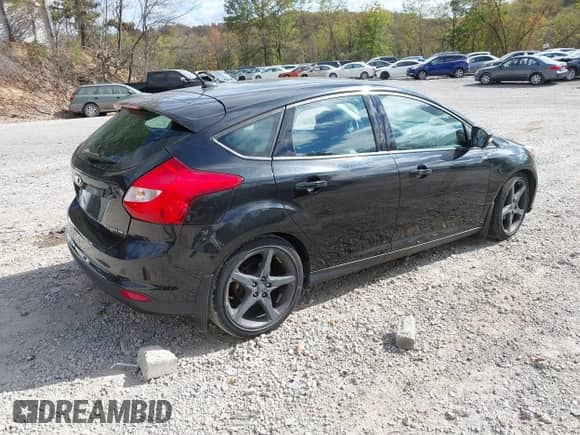 2014 Ford Focus Titanium with VIN 1FADP3N21EL136254, listed as a IAAI auction lot 43420903 with 106,629 mi miles and . Bid and sale history available at DreamBid. Image 4.