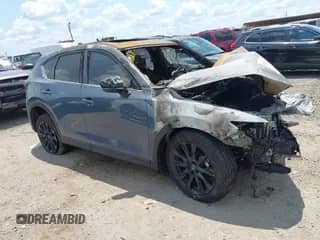 2023 Mazda CX-5 S Preferred z VIN JM3KFBCM2P0233638, wystawiony jako IAAI lot #42915682 z przebiegiem 62 982 mil mil oraz . Historia ofert i sprzedaży dostępna na DreamBid. Obrazek 1.