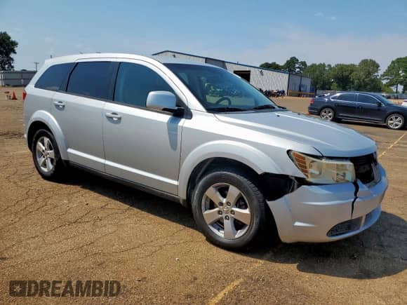 2009 Dodge Journey SXT with VIN 3D4GG57V99T568050, listed as a Copart auction lot 69966605 with 174,837 mi miles and Salvage title. Bid and sale history available at DreamBid. Image 4.