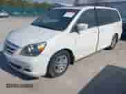 2007 Honda Odyssey EX-L z VIN 5FNRL38677B435716, wystawiony jako IAAI lot #43376334 z przebiegiem 253 875 mil mil oraz . Historia ofert i sprzedaży dostępna na DreamBid. Obrazek 2.