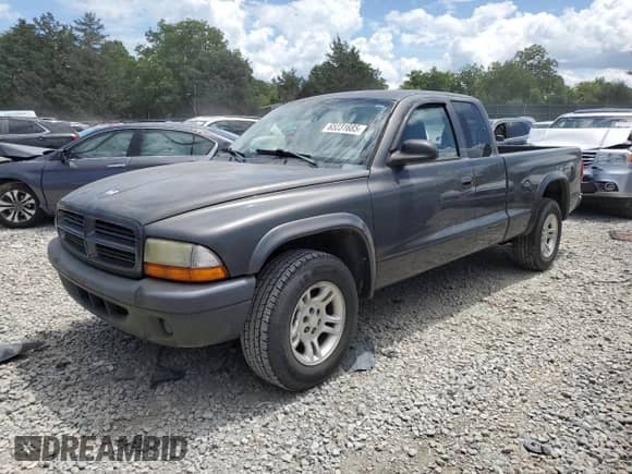 2003 Dodge Dakota с VIN 1D7HL12X93S188638, выставлен на аукционе Copart как лот 65231685 с пробегом 102 617 миль миль и Списание • Salvage title. История ставок и продаж доступна на DreamBid. Изображение 1.