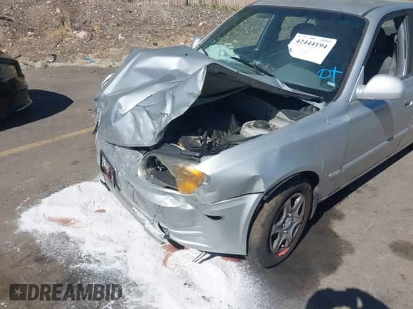 2004 Hyundai Accent GL z VIN KMHCG45C74U567268, wystawiony jako IAAI lot #42444194 z przebiegiem 182 380 mil mil oraz . Historia ofert i sprzedaży dostępna na DreamBid. Obrazek 6.