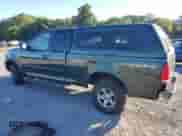 2003 Ford F-150 XL with VIN 1FTRX18W13NA70373, listed as a Copart auction lot 70267965 with 71,366 mi miles and Salvage title. Bid and sale history available at DreamBid. Image 2.