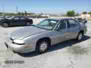 1997 Chevrolet Lumina with VIN 2G1WL52MXV9329759, listed as a Copart auction lot 64627275 with 132,892 mi miles and Salvage title. Bid and sale history available at DreamBid. Image 1.