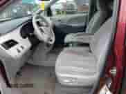 2014 Toyota Sienna LE with VIN 5TDJK3DC8ES083704, listed as a Copart auction lot 84932195 with 210,428 mi miles and Salvage title. Bid and sale history available at DreamBid. Image 7.