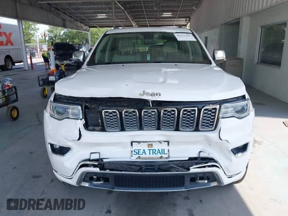 2018 Jeep Grand Cherokee Overland with VIN 1C4RJFCG8JC229381, listed as a IAAI auction lot 42221266 with 102,230 mi miles and . Bid and sale history available at DreamBid. Image 12.