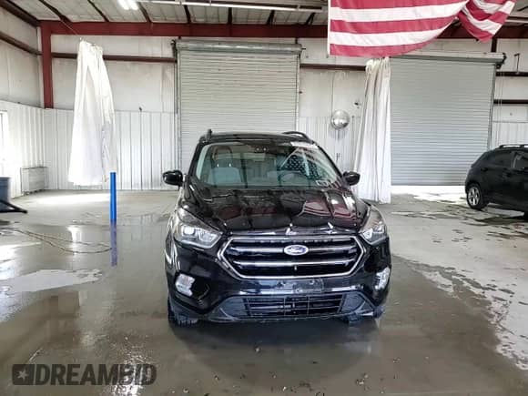 2018 Ford Escape SE with VIN 1FMCU9GD2JUC25153, listed as a Copart auction lot 87018485 with 104,172 mi miles and Salvage title. Bid and sale history available at DreamBid. Image 15.