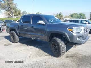 2021 Toyota Tacoma SR with VIN 3TMCZ5AN1MM449247, listed as a IAAI auction lot 43012687 with Not provided miles and . Bid and sale history available at DreamBid. Image 1.