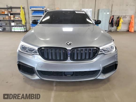 2018 BMW 5 Series M550i xDrive with VIN WBAJB9C51JB034817, listed as a Copart auction lot 69056245 with 132,405 mi miles and Salvage title. Bid and sale history available at DreamBid. Image 5.