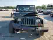 2007 Jeep Wrangler Sahara z VIN 1J8FA54107L153759, wystawiony jako Copart lot #61725475 z przebiegiem Nie podano mil oraz Szkoda całkowita • Salvage title. Historia ofert i sprzedaży dostępna na DreamBid. Obrazek 5.