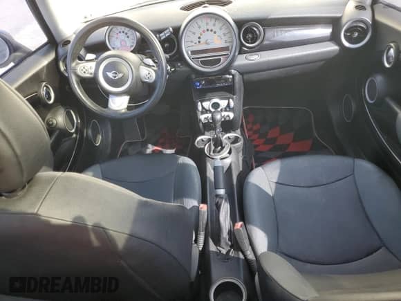 2007 MINI Hardtop with VIN WMWMF33547TT51590, listed as a Copart auction lot 57323995 with 114,113 mi miles and Salvage title. Bid and sale history available at DreamBid. Image 8.