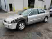 1997 Honda Accord Special Edition with VIN 1HGCD5602VA240028, listed as a Copart auction lot 82034045 with 207,053 mi miles and Salvage title. Bid and sale history available at DreamBid. Image 1.