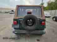 2001 Jeep Wrangler Sahara with VIN 1J4FA59S31P324555, listed as a Copart auction lot 84462425 with 137,096 mi miles and Clean title. Bid and sale history available at DreamBid. Image 6.