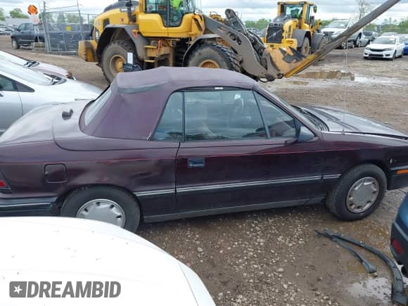 1991 Dodge Shadow with VIN 3B3XP45K5MT615827, listed as a IAAI auction lot 42157848 with 70,501 mi miles and . Bid and sale history available at DreamBid. Image 13.