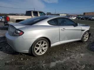 2007 Hyundai Tiburon GT с VIN KMHHN66F67U250702, выставлен на аукционе Copart как лот 42036935 с пробегом 118 061 миль миль и Списание • Salvage title. История ставок и продаж доступна на DreamBid. Изображение 3.