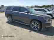 2016 Chevrolet Tahoe LTZ with VIN 1GNSCCKC0GR203654, listed as a Copart auction lot 54906895 with 74,805 mi miles and Salvage title. Bid and sale history available at DreamBid. Image 4.