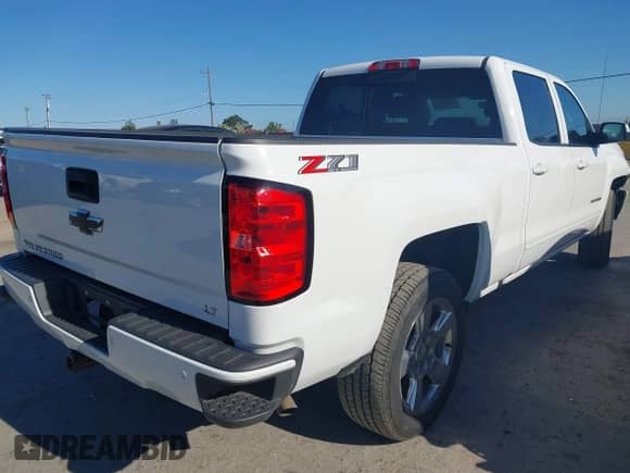 2018 Chevrolet Silverado 1500 LT with VIN 1GCUKRECXJF180945, listed as a IAAI auction lot 42450588 with 108,199 mi miles and . Bid and sale history available at DreamBid. Image 4.