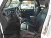 2023 Jeep Wrangler Sahara with VIN 1C4JJXP69PW556187, listed as a Copart auction lot 67539065 with 54,671 mi miles and Salvage title. Bid and sale history available at DreamBid. Image 7.