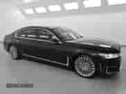 2020 BMW 7 Series 740i with VIN WBA7T2C07LCD04975, listed as a Copart auction lot 60989495 with 121,769 mi miles and Clean title. Bid and sale history available at DreamBid. Image 4.
