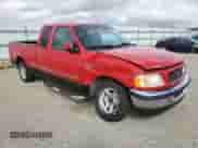 1998 Ford F-150 with VIN 2FTZX1729WCA55063, listed as a Copart auction lot 81871435 with 229,574 mi miles and Salvage title. Bid and sale history available at DreamBid. Image 4.