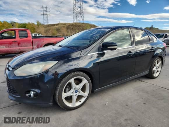 2014 Ford Focus Titanium with VIN 1FADP3J28EL224272, listed as a Copart auction lot 86531015 with 192,653 mi miles and Clean title. Bid and sale history available at DreamBid. Image 1.