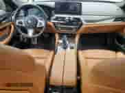 2021 BMW 5 Series 540i xDrive with VIN WBA73BJ05MWW99867, listed as a Copart auction lot 69265535 with 56,512 mi miles and Salvage title. Bid and sale history available at DreamBid. Image 8.